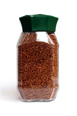 Instant coffee lies in a glass jar on a white background.