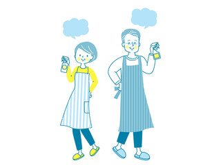 家の中を除菌する笑顔のシニア夫婦