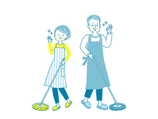 フローリングを掃除する笑顔のシニア夫婦