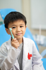 Asian kid check up with dentist at the dental clinic. Concept of dental check up and healthcare