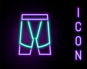 Glowing neon line Cycling shorts icon isolated on black background. Colorful outline concept. Vector