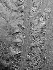 Ice crystals in the detail on a window glass in winter time