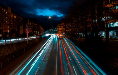 Fototapeta na wymiar Long exposure at night with cars in city, above