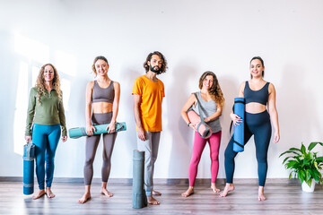 Fototapeta premium Man and women in yoga studio