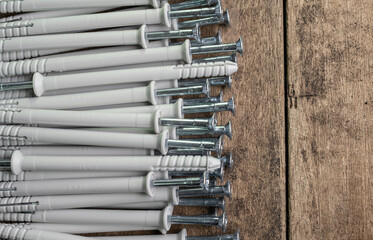 Selective focus. Close up shooting of parts of  screws with cross head. Industrial background