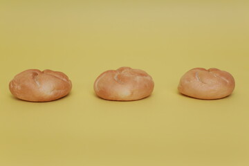three buns on the yellow background