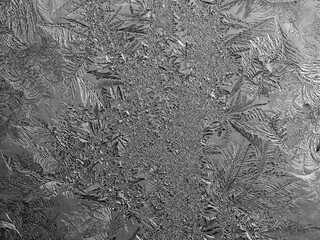 Ice crystals in the detail on a window glass in winter time