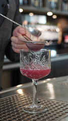 Alcoholic cocktails in a dark-lid bar environment from Berlin, Germany.