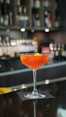 Alcoholic cocktails in a dark-lid bar environment from Berlin, Germany.