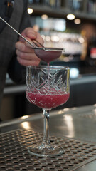 Alcoholic cocktails in a dark-lid bar environment from Berlin, Germany.