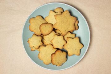 Homemade shortbread cookies on a pink background. Delicious and light dessert. Cookies on a plate.