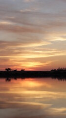 Obraz premium sunset over the river