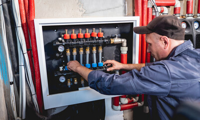 HVAC technician servicing home heating and cooling system