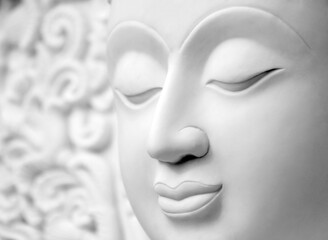 face of white stone buddha