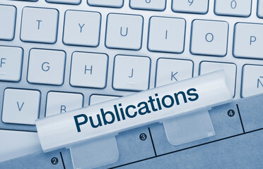 Publications - Inscription on Blue Keyboard Key.