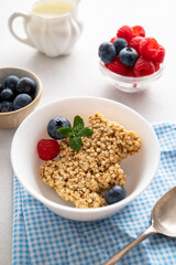 Funny oat cereal bar, bear shape with fresh berries, breakfast for kids.