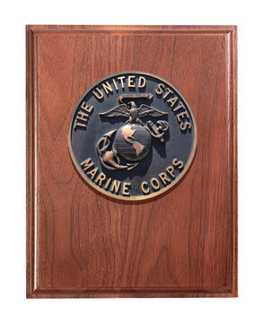 Los Angeles, California  USA - March 12 2019: U.S. Marine Corps, crest or walnut plaque isolated on white background