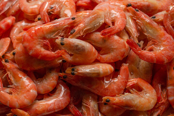Shrimps background texture. A lot of shrimps. Cooked shrimps.