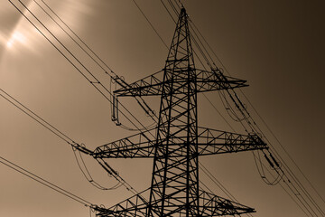 Electricity pylon against the sky. High - voltage power lines .