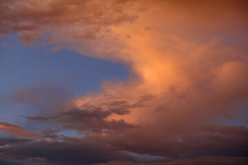 Sky with clouds at sunset. Beautiful background for text.
