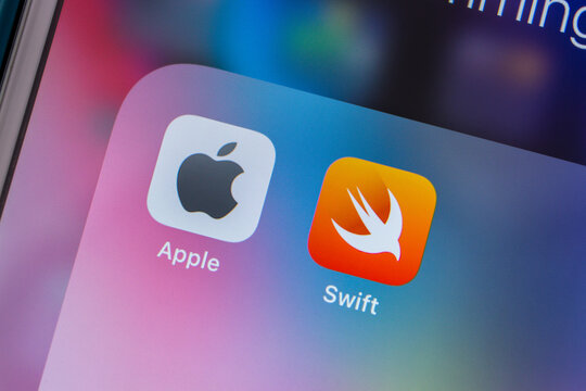 Kumamoto, JAPAN - Feb 15 2021 : Concept image Apple and Swift icons on iPhone. Swift is a general-purpose, multi-paradigm, compiled programming language developed by Apple Inc.
