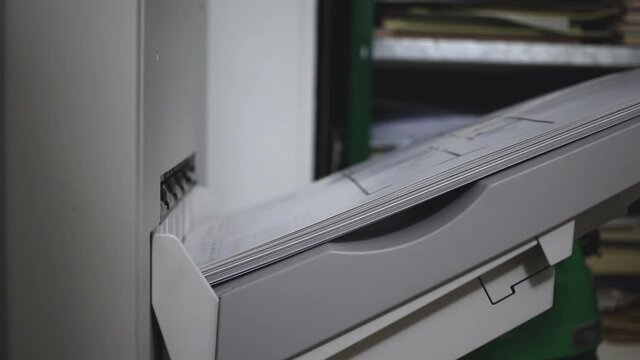 Process of printing products close-up view. Paper, newspaper, print shop manufacturing concept