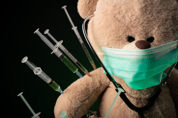 children's vaccination against the covid19 virus and vaccinations on the example of a teddy bear