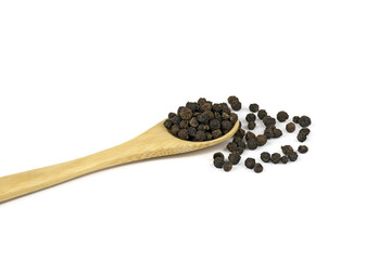 Black pepper on wooden spoon isolated on white background.