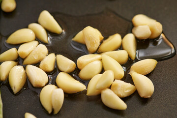 Oil and raw garlic in a pan