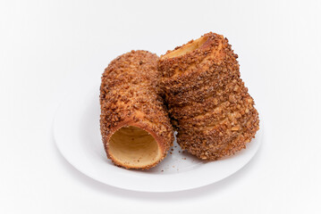 trdelnik on a on a white plate on a white background