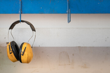 An earmuff, the PPE which is use to protect loud noise in worker environment, its handing on the...