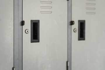 Row of metal locker box. Interior object and textured pattern photo. Selective focus.