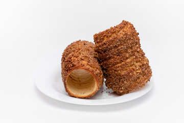 trdelnik on a on a white plate on a white background