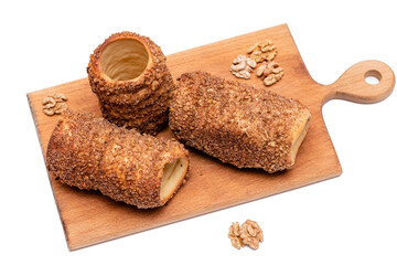trdelnik on a wooden board on a white background