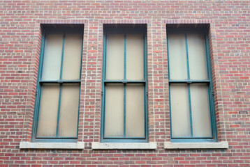 old window with brick wall