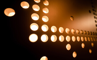 Metal sheet with lights braille dots background.