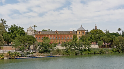 Fototapeta na wymiar Palacio de San Telmo along river Guadalquivir in Seville,