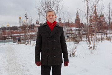 An elderly, slender man walks in the winter park Zaryadye. Moscow. Hiking, rest