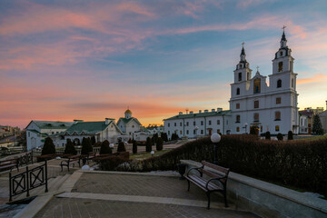View of the Cathedral of the Descent of the Holy Spirit and the Church of St. Cyril  Turovsky on a winter morning against a pink dawn sky, Minsk, Belarus