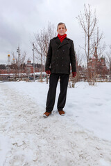 An elderly, slender man walks in the winter park Zaryadye. Moscow. Hiking, rest