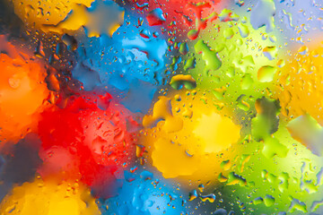 abstract colored balls of oily liquid on a blurred background