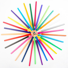Colored pencils for drawing on a white background. Items for creativity and art