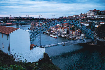 Obraz premium View of the Dom Luis Iron Bridge over the Douro River at dusk, Porto, Portugal.