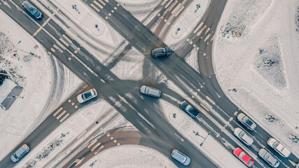 Street intersection in winter, aerial view. Low traffic on snowy winter day