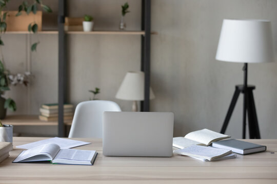 Home Office Workspace Or Studying Interior With No People. Work Table With Open Books And Laptop Computer, Chair At Desk. Workplace For Businessperson, Employee, Worker, Student. Nobody, Objects