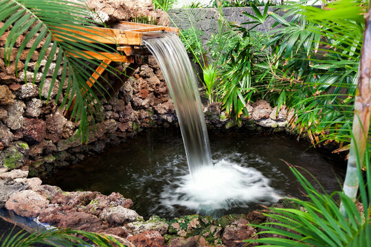Traditional wooden fountain with flowing water