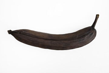 Obraz premium Rotten black banana isolated on white background