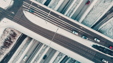 Street intersection in winter, aerial view. Low traffic on snowy winter day