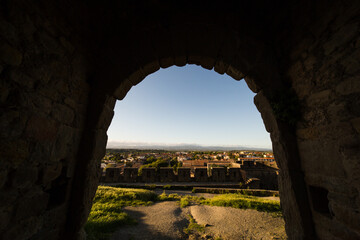 View of Carcassonne City in France from its Medieval Citadel (Cité Médiévale) Northern Entry Porch at Sunset