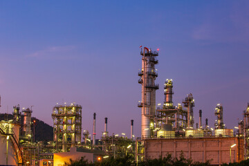 Oil​ refinery​ and​ plant of petrochemistry industry oil​ and​ gas​ ​industry with​ cloud​ ​sky the sunset